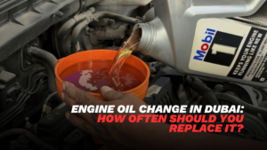 Engine oil change in Dubai with technician pouring fresh oil into car engine