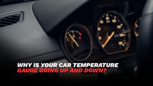 Car dashboard temperature gauge showing an unusually high engine temperature reading